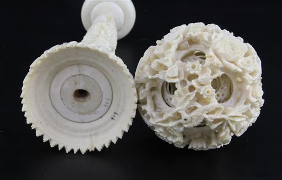 A Chinese ivory concentric puzzle ball and stand, early 20th century, ball 6.7cm, total height 23cm